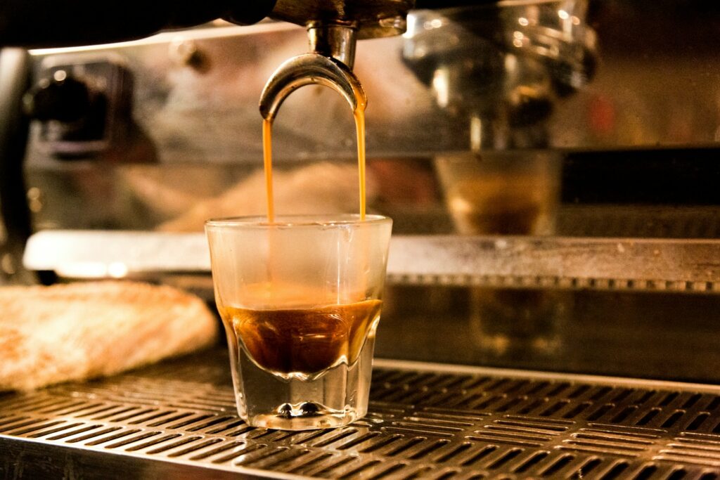 Espresso shot pouring into a cup during extraction
