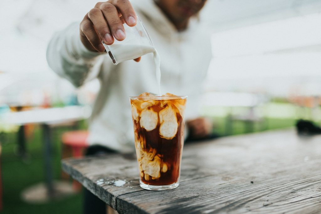 Iced coffee showing dilution from melting ice